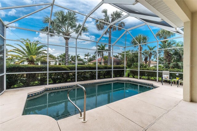 117 Abercrombie Ave, Englewood, FL 34223 - swimming pool with a patio area and glass enclosure