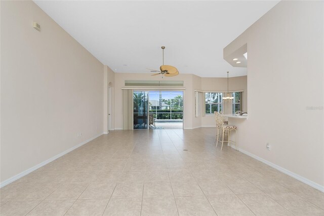 117 Abercrombie Ave, Englewood, FL 34223 - unfurnished living room with ceiling fan, light tile patterned floors, and recessed lighting