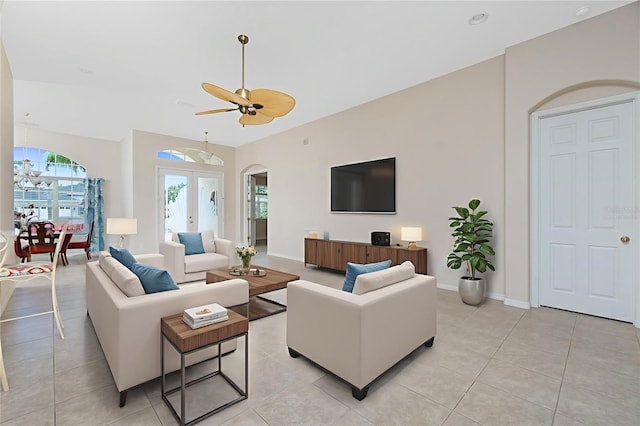117 Abercrombie Ave, Englewood, FL 34223 - living area featuring arched walkways, ceiling fan, and light tile patterned floors