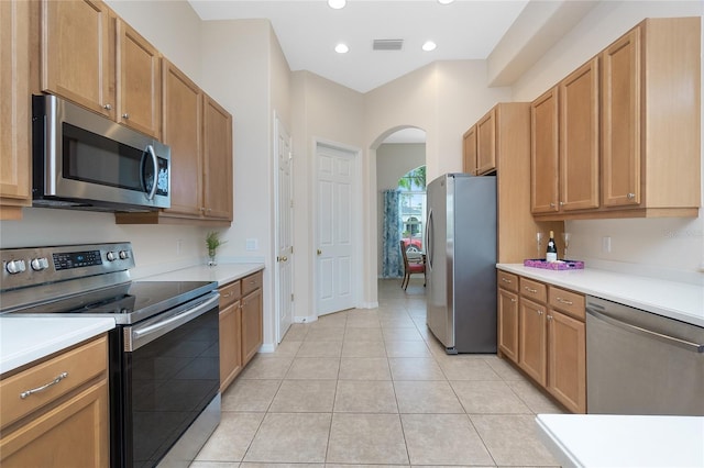 117 Abercrombie Ave, Englewood, FL 34223 - kitchen with appliances with stainless steel finishes, arched walkways, light countertops, light tile patterned floors, and recessed lighting