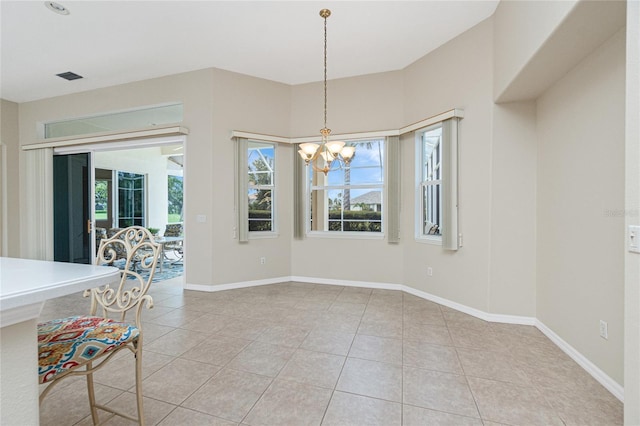 117 Abercrombie Ave, Englewood, FL 34223 - unfurnished dining area with a chandelier and light tile patterned floors