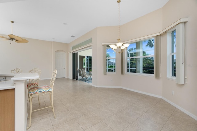 117 Abercrombie Ave, Englewood, FL 34223 - unfurnished dining area with a chandelier, light tile patterned floors, and ceiling fan