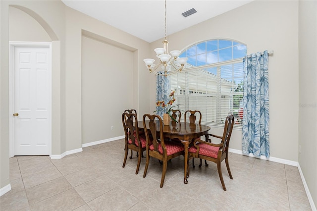 117 Abercrombie Ave, Englewood, FL 34223 - dining room with a chandelier, arched walkways, and light tile patterned floors