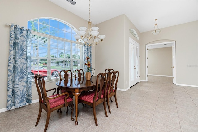 117 Abercrombie Ave, Englewood, FL 34223 - dining room featuring a chandelier, light tile patterned flooring, and vaulted ceiling