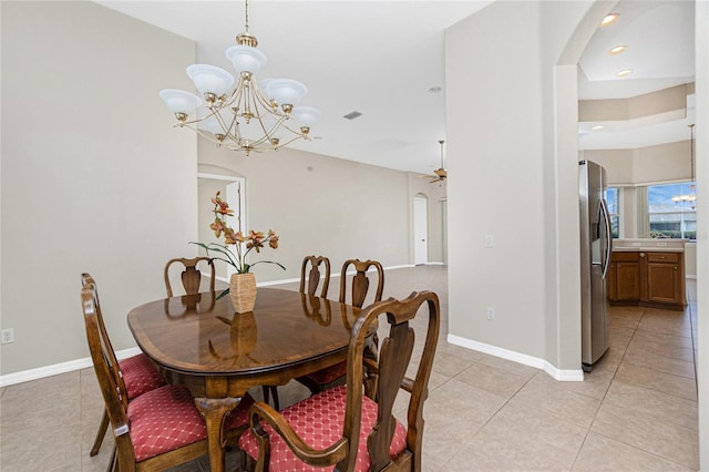 117 Abercrombie Ave, Englewood, FL 34223 - dining space with arched walkways, a chandelier, light tile patterned floors, and recessed lighting