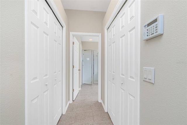 117 Abercrombie Ave, Englewood, FL 34223 - hallway with light tile patterned floors and a textured wall