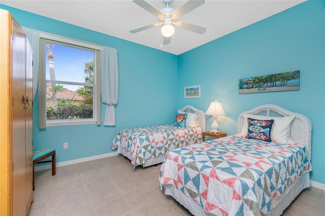 117 Abercrombie Ave, Englewood, FL 34223 - tiled bedroom featuring baseboards and a ceiling fan