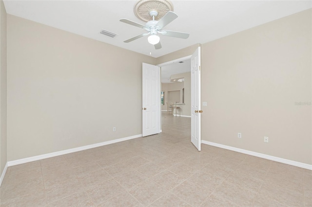 117 Abercrombie Ave, Englewood, FL 34223 - empty room with a ceiling fan and baseboards
