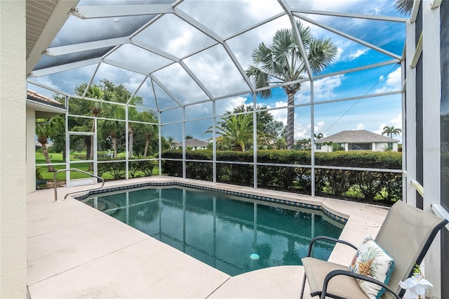 117 Abercrombie Ave, Englewood, FL 34223 - swimming pool featuring glass enclosure and a patio