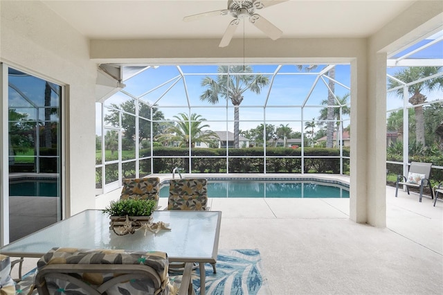 117 Abercrombie Ave, Englewood, FL 34223 - outdoor pool with a patio area, a lanai, a ceiling fan, and outdoor dining space