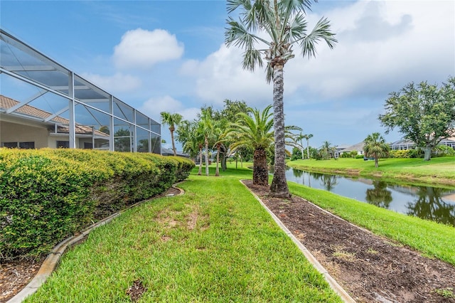 117 Abercrombie Ave, Englewood, FL 34223 - view of green lawn with a water view and glass enclosure