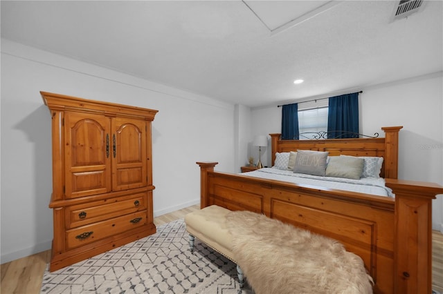 1730 Bluebird Ln, Englewood, FL 34224 - bedroom with light wood-style floors, attic access, and recessed lighting