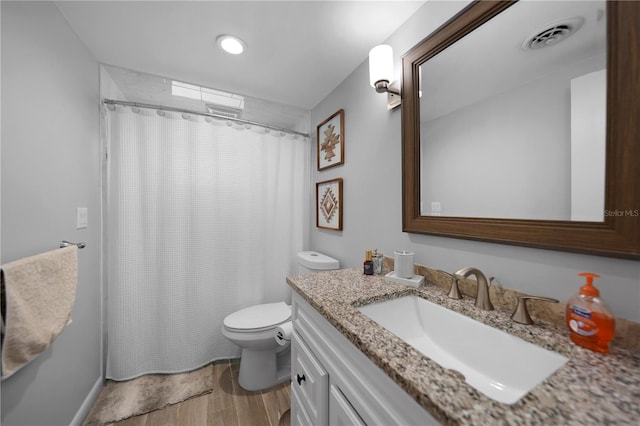 1730 Bluebird Ln, Englewood, FL 34224 - bathroom featuring vanity, curtained shower, and wood finished floors