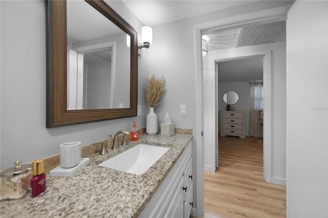 1730 Bluebird Ln, Englewood, FL 34224 - bathroom featuring wood finished floors and vanity