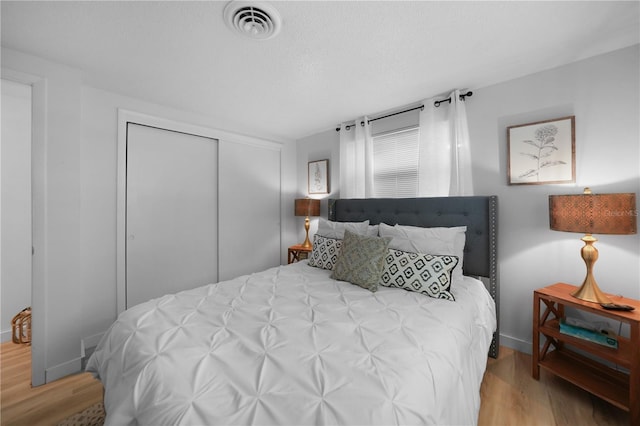 1730 Bluebird Ln, Englewood, FL 34224 - bedroom featuring wood finished floors and a closet