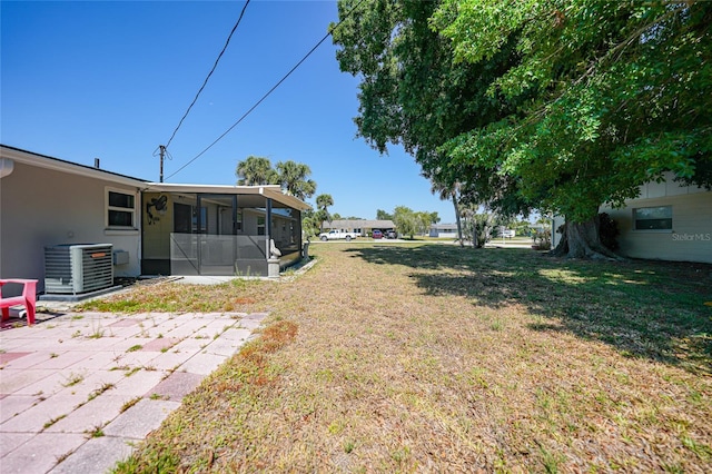1730 Bluebird Ln, Englewood, FL 34224 - view of green lawn featuring a sunroom and a patio area