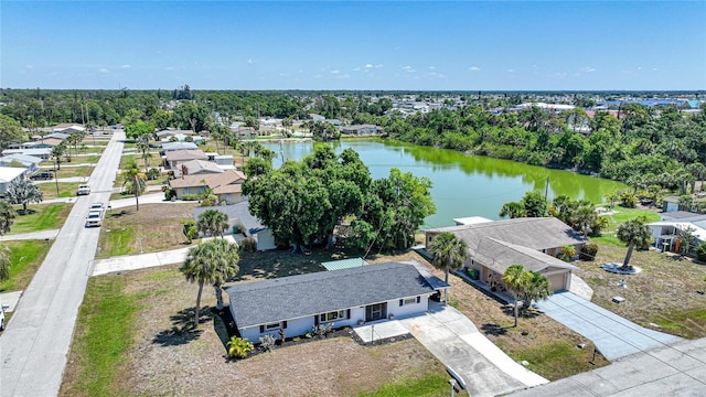 1730 Bluebird Ln, Englewood, FL 34224 - aerial view of residential area with a large body of water and a tree filled landscape