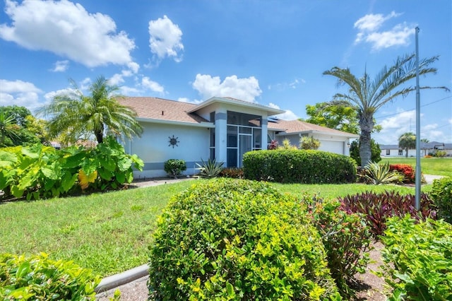 727 Rotonda Cir, Rotonda West, FL 33947 - ranch-style house with an attached garage, stucco siding, and a front lawn