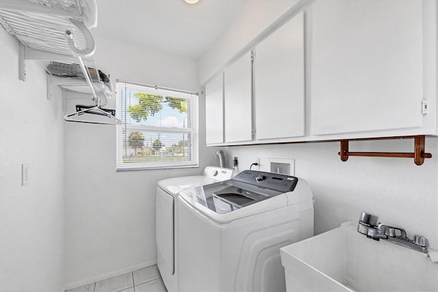 727 Rotonda Cir, Rotonda West, FL 33947 - washroom featuring cabinet space, washer and clothes dryer, and light marble finish floors