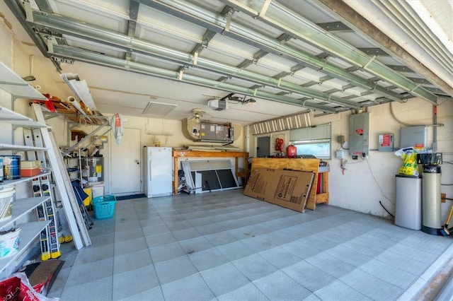 727 Rotonda Cir, Rotonda West, FL 33947 - garage with electric panel, a garage door opener, and freestanding refrigerator