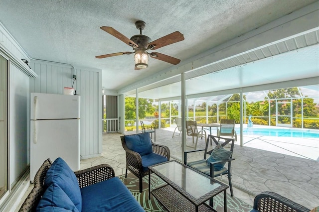 727 Rotonda Cir, Rotonda West, FL 33947 - sunroom / solarium with a ceiling fan and a pool