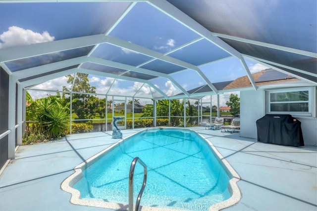 727 Rotonda Cir, Rotonda West, FL 33947 - swimming pool with area for grilling, a patio, and glass enclosure