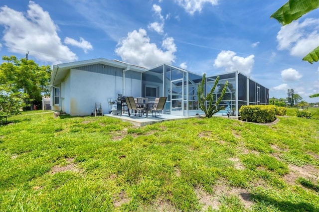727 Rotonda Cir, Rotonda West, FL 33947 - rear view of property with stucco siding, a patio area, and a yard