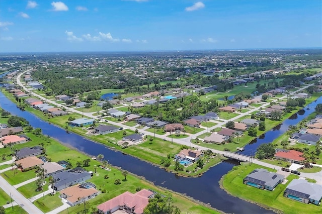 727 Rotonda Cir, Rotonda West, FL 33947 - aerial overview of property's location with nearby suburban area and a large body of water