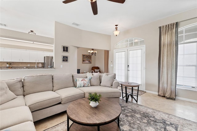 39 Pine Valley Ct, Rotonda West, FL 33947 - living room with a chandelier, a ceiling fan, and light tile patterned floors
