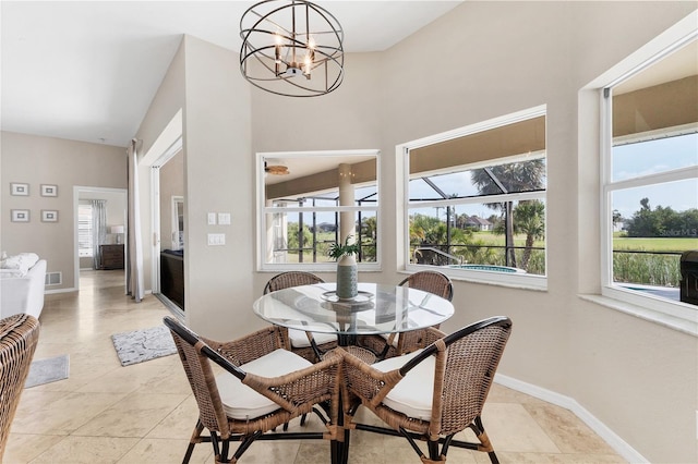 39 Pine Valley Ct, Rotonda West, FL 33947 - dining space featuring a chandelier and baseboards
