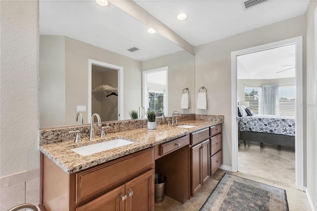 39 Pine Valley Ct, Rotonda West, FL 33947 - bathroom with ensuite bath and double vanity