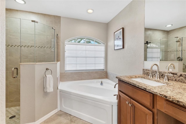 39 Pine Valley Ct, Rotonda West, FL 33947 - full bathroom featuring a shower stall, a bath, vanity, and recessed lighting