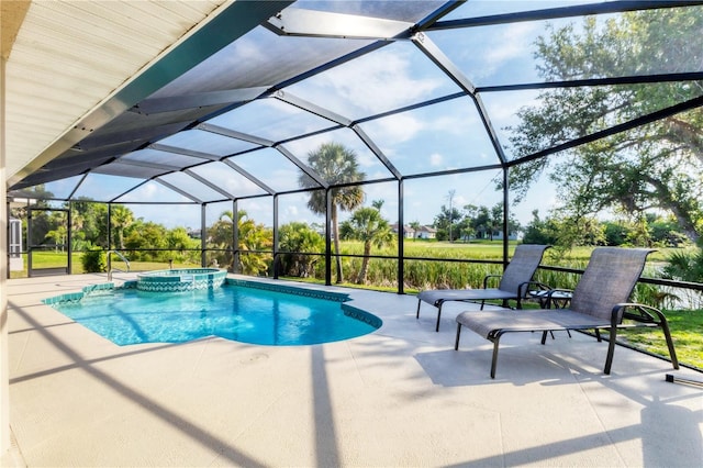 39 Pine Valley Ct, Rotonda West, FL 33947 - view of swimming pool featuring a patio, a pool with connected hot tub, and glass enclosure