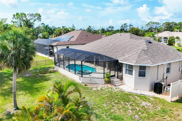 39 Pine Valley Ct, Rotonda West, FL 33947 - back of property featuring roof with shingles, a fenced backyard, a patio area, and stucco siding