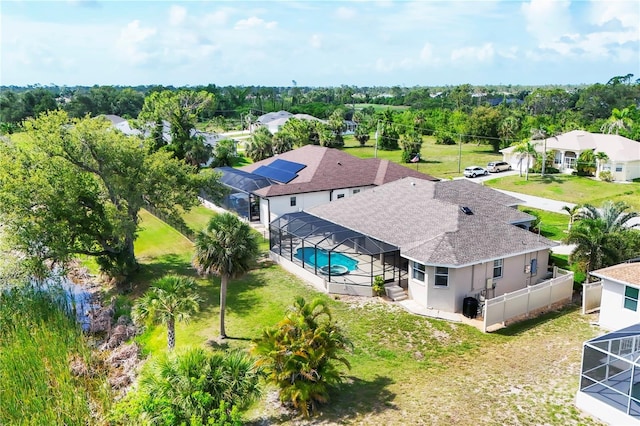 39 Pine Valley Ct, Rotonda West, FL 33947 - view of subject property featuring a pool and a tree filled landscape