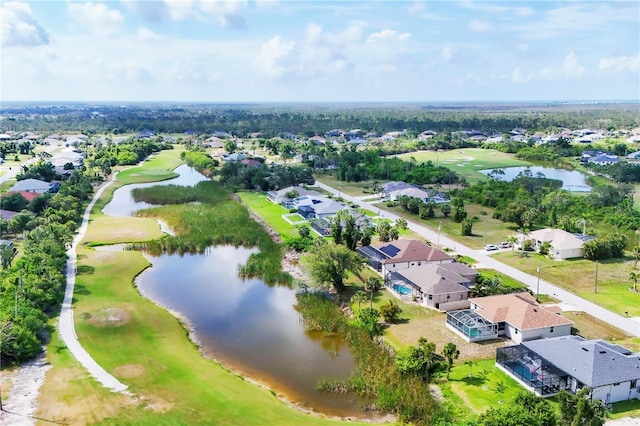 39 Pine Valley Ct, Rotonda West, FL 33947 - aerial perspective of suburban area featuring a local golf course and a large body of water