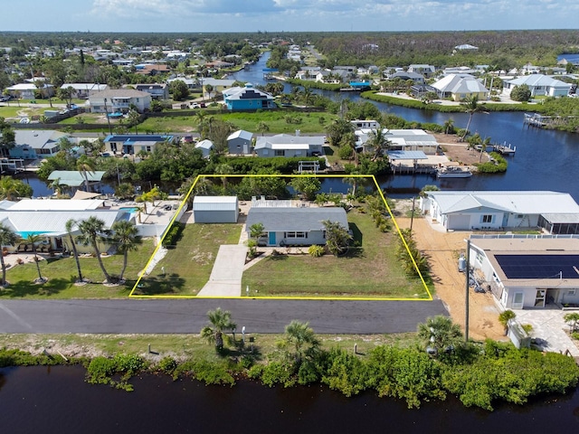 1060 Haste Ln, Englewood, FL 34223 - aerial perspective of suburban area featuring property parcel outlined and a nearby body of water