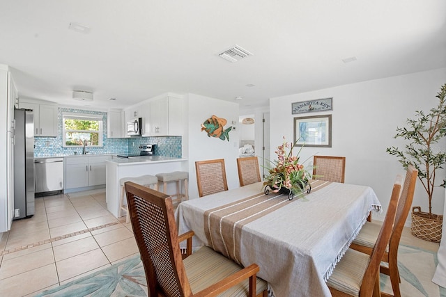 1060 Haste Ln, Englewood, FL 34223 - dining space with light tile patterned floors