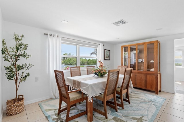 1060 Haste Ln, Englewood, FL 34223 - dining space featuring light tile patterned floors and baseboards