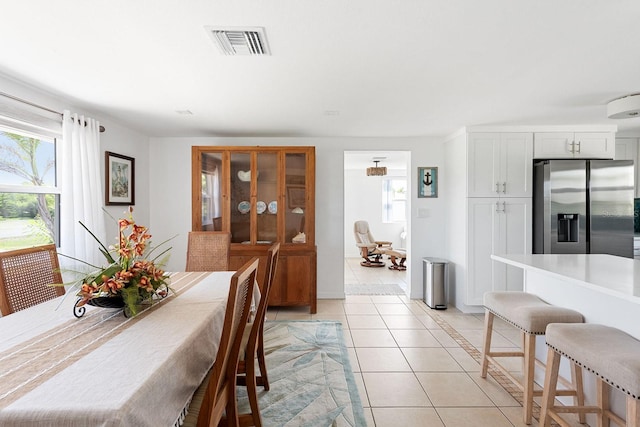 1060 Haste Ln, Englewood, FL 34223 - dining area with healthy amount of natural light and light tile patterned floors