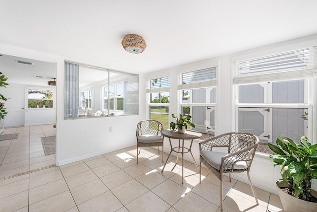1060 Haste Ln, Englewood, FL 34223 - sunroom with tile patterned floors
