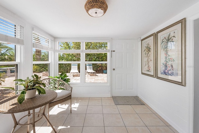 1060 Haste Ln, Englewood, FL 34223 - sunroom / solarium with tile patterned floors and baseboards