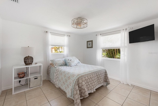1060 Haste Ln, Englewood, FL 34223 - bedroom featuring light tile patterned flooring