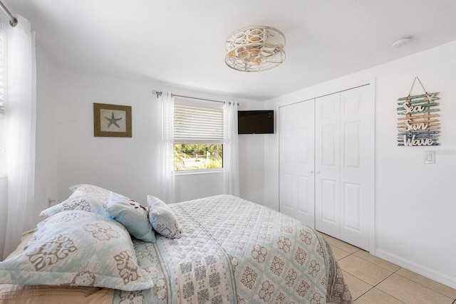 1060 Haste Ln, Englewood, FL 34223 - bedroom featuring light tile patterned floors and a closet