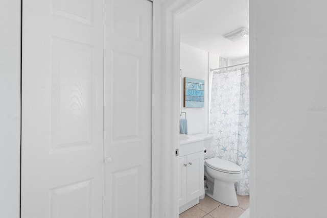 1060 Haste Ln, Englewood, FL 34223 - full bathroom with tile patterned floors, vanity, a closet, and a shower with shower curtain
