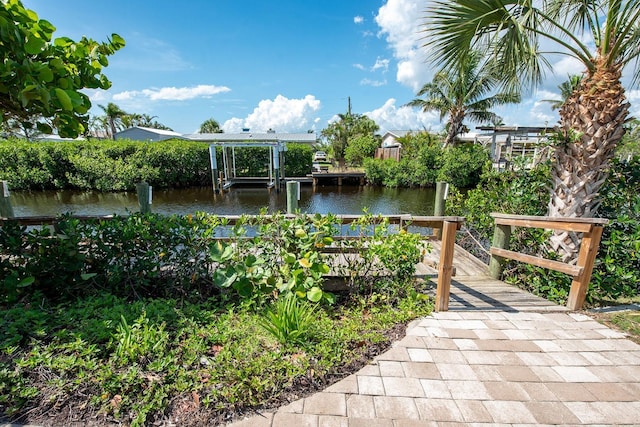 1060 Haste Ln, Englewood, FL 34223 - view of community featuring boat lift, a boat dock, and a water view