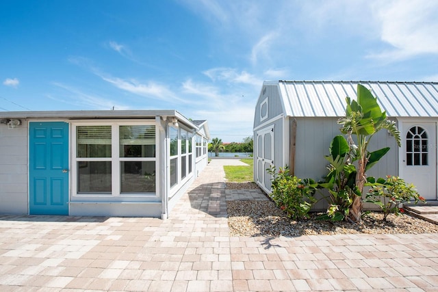 1060 Haste Ln, Englewood, FL 34223 - view of property exterior featuring a patio area and an outdoor structure