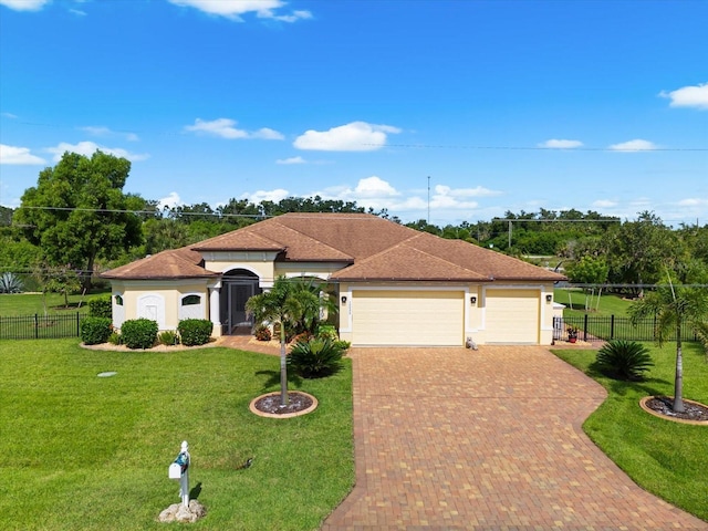 10029 Boylston St, Port Charlotte, FL 33981 - mediterranean / spanish home with stucco siding, an attached garage, and decorative driveway