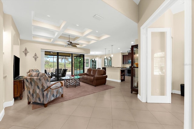 10029 Boylston St, Port Charlotte, FL 33981 - living area with coffered ceiling, beamed ceiling, a ceiling fan, light tile patterned floors, and recessed lighting