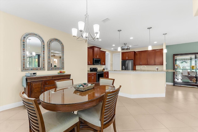 10029 Boylston St, Port Charlotte, FL 33981 - dining area with a chandelier, light tile patterned flooring, and recessed lighting